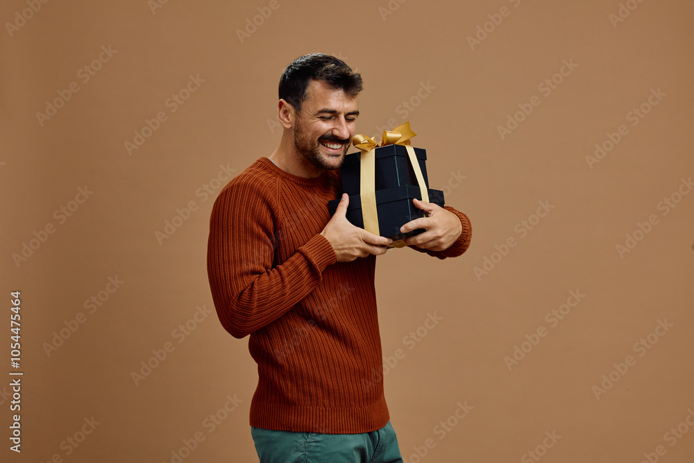 Happy man feeling satisfied with the gifts has bought. Happy man feeling satisfied with the gifts has bought.