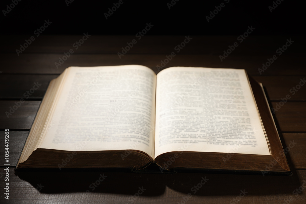 Fototapeta premium Open Bible on wooden table. Christian faith