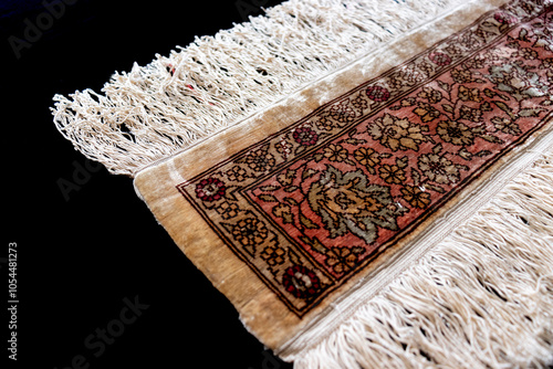 silk woven carpet hand woven with fine woven detail. photo