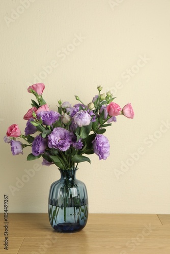 Wallpaper Mural Vase with beautiful eustoma flowers on wooden table Torontodigital.ca