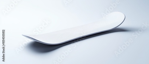 Sleek white snowboard design on a smooth white background, highlighting modern snow sports equipment.