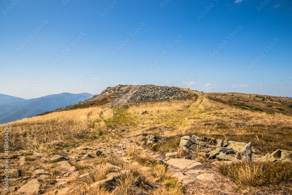 The Stunning and Scenic Mountain Ridge Beneath a Clear Blue Sky and Endless Horizons The Stunning and Scenic Mountain Ridge Beneath a Clear Blue Sky and Endless Horizons
