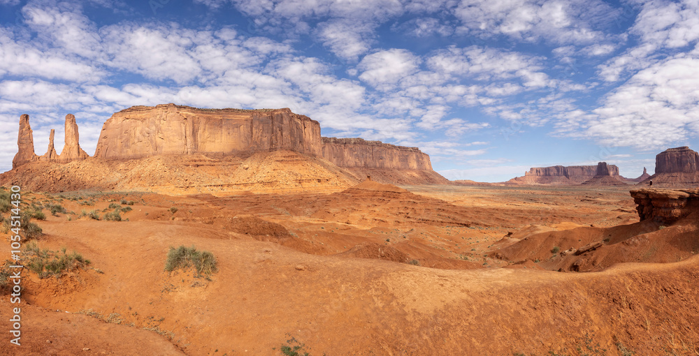 Panorama of Three Sisters formation and large mesa from the valley floor in Monument Valley, Arizona, USA on 21 April 2024 Panorama of Three Sisters formation and large mesa from the valley floor in Monument Valley, Arizona, USA on 21 April 2024