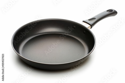 Black metal pan with non stick coating isolated on white background