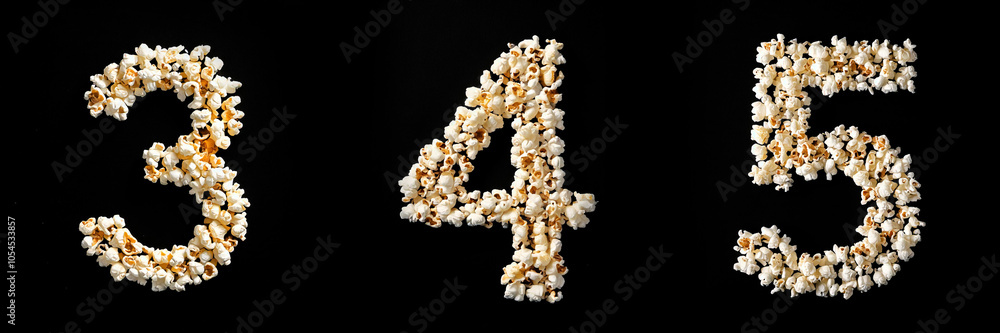 Numbers 3, 4, 5. Alphabet Made of Popcorn on Black Background. Numbers 3, 4, 5. Alphabet Made of Popcorn on Black Background.