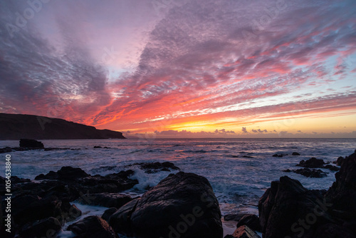 Winter sunset over the ocean at the Gauldrons Beach, Scotland