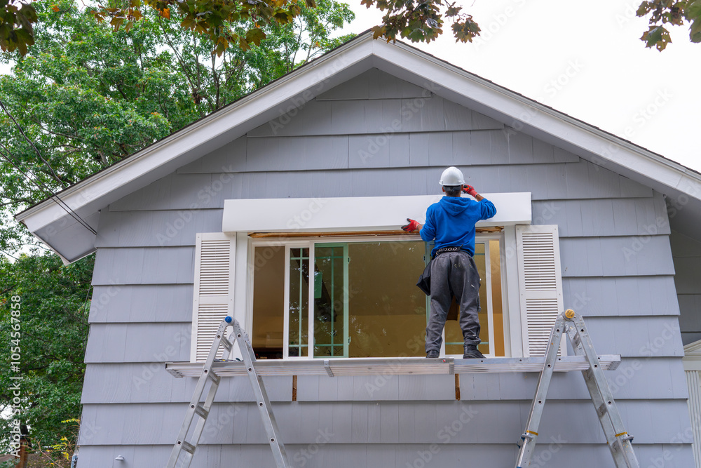 Fototapeta premium contractor working on replacing the window of the house