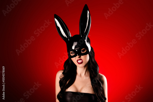 Photo of gorgeous lady dangerous animal grinning foreplay in bunny costume on red gradient color background