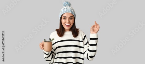Happy young woman holding g...