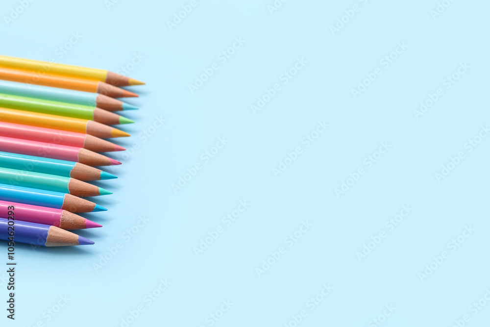Many colorful pencils on blue background Many colorful pencils on blue background