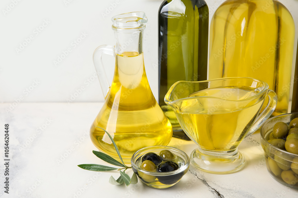 Different glassware of fresh olive oil on table Different glassware of fresh olive oil on table