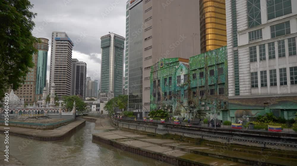 cloudy day kuala lumpur city famous downtown riverside delta slow motion panorama 4k malaysia