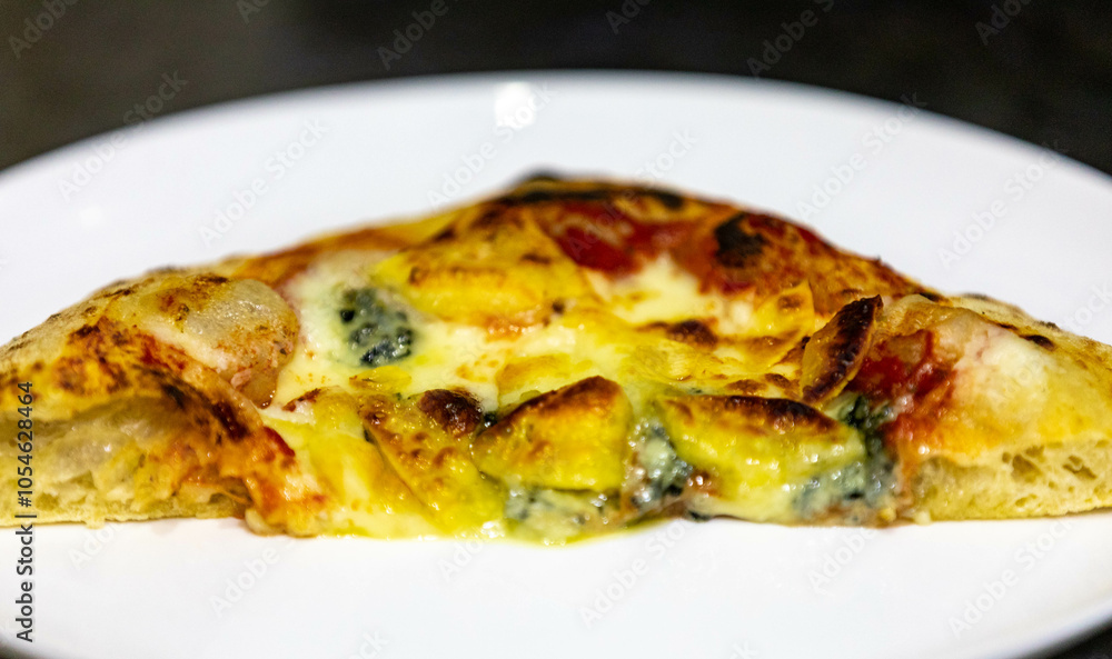 Traditional rustic pizza made with four cheeses, garlic and oil and pear with gorgonzola Traditional rustic pizza made with four cheeses, garlic and oil and pear with gorgonzola