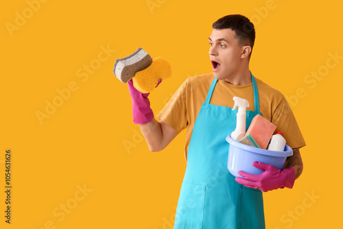 Surprised young man with cl...