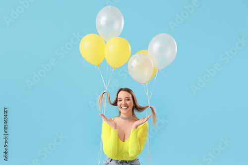 Young woman with balloons o...