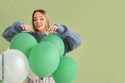 Young woman with balloons o...
