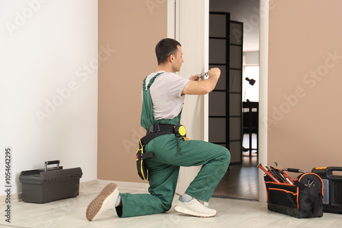 Male worker with screwdrive...