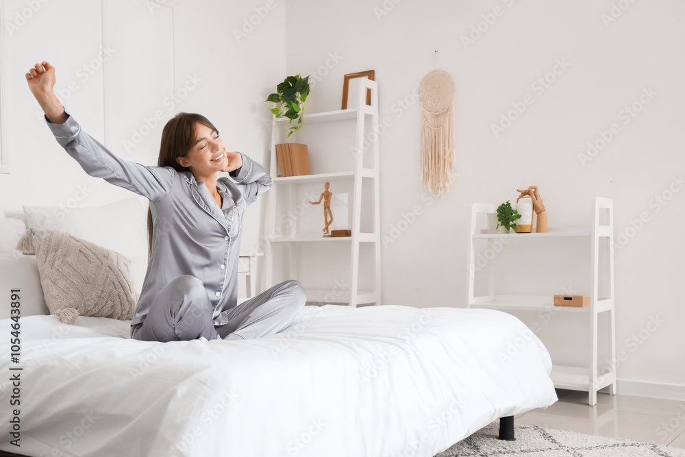 Morning of beautiful young woman stretching in bedroom Morning of beautiful young woman stretching in bedroom