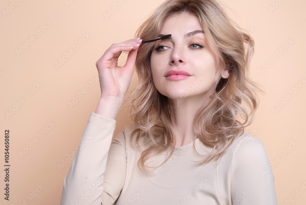 Woman shaping brown eyebrows. Woman eye with beautiful eyebrows. Shaped brows, long eyelashes. Paint eyebrows. Girl contouring eyebrows on isolated studio background. Woman shaping brown eyebrows. Woman eye with beautiful eyebrows. Shaped brows, long eyelashes. Paint eyebrows. Girl contouring eyebrows on isolated studio background.