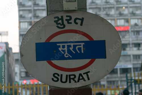 Fényképezés Surat, India - 25 April 2024, Platform board, sign name plate at Surat railway station(western railway) written in Hindi, Gujarati and English