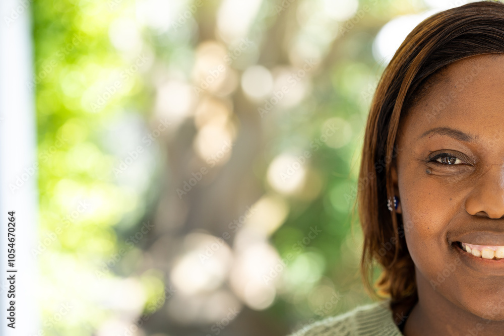 Smiling african american woman enjoying sunny day outdoors, copy space, at home Smiling african american woman enjoying sunny day outdoors, copy space, at home