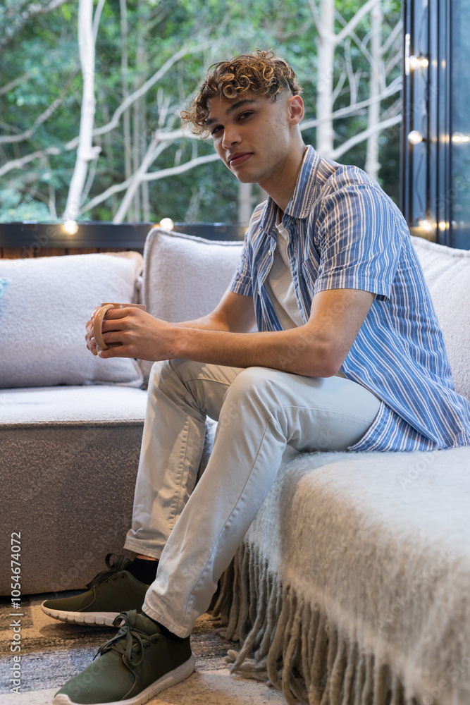 Christmas time, Young man relaxing on cozy sofa at home, enjoying peaceful moment Christmas time, Young man relaxing on cozy sofa at home, enjoying peaceful moment