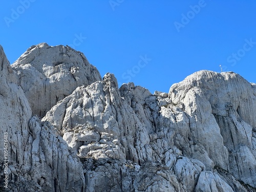 Rocky ridge of Tulove grede or karst mountain peak of Tulovice - Velebit Nature Park, Croatia (Stjenoviti greben Tulove grede ili krški planinski vrh Tulovice - Park prirode Velebit, Hrvatska) photo