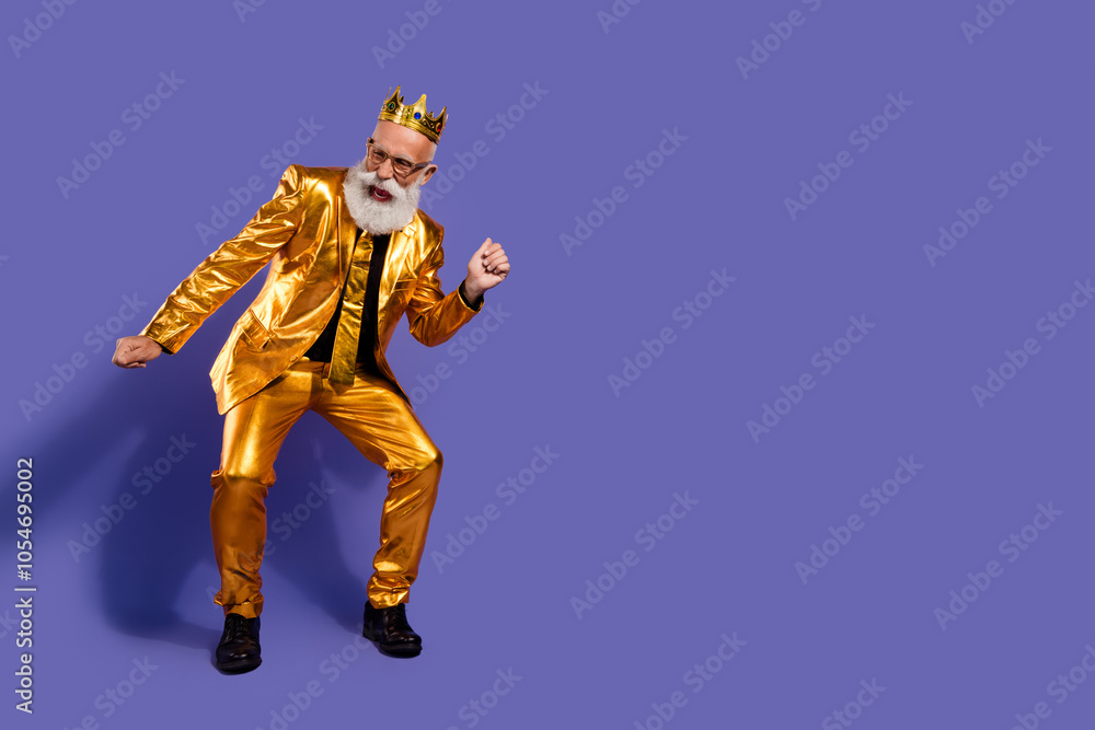 Full size photo of charismatic extravagant man dancing empty space golden costume isolated on violet color background Full size photo of charismatic extravagant man dancing empty space golden costume isolated on violet color background
