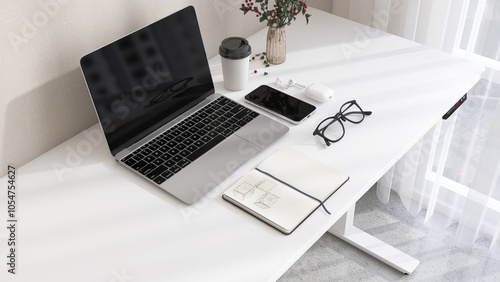 Foto Desktop of modern white stand up desk with laptop computer, smartphone, earphone
