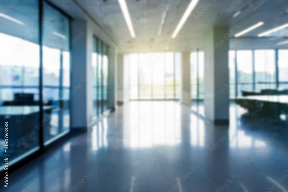 Blurred empty open space office. Abstract light bokeh at office interior background Blurred empty open space office. Abstract light bokeh at office interior background