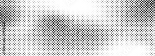 Halftone grungy background. Fading grain gritty textured wallpaper. Black and white comic noise grit surface. Pixelated speckles, dots and particles overlay. Aged dirty sand backdrop cover. Vector