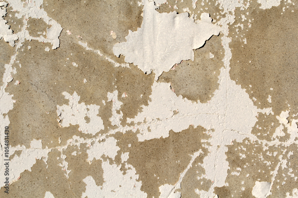 Close-up of a weathered concrete wall with peeling white paint abstract textured background Close-up of a weathered concrete wall with peeling white paint abstract textured background