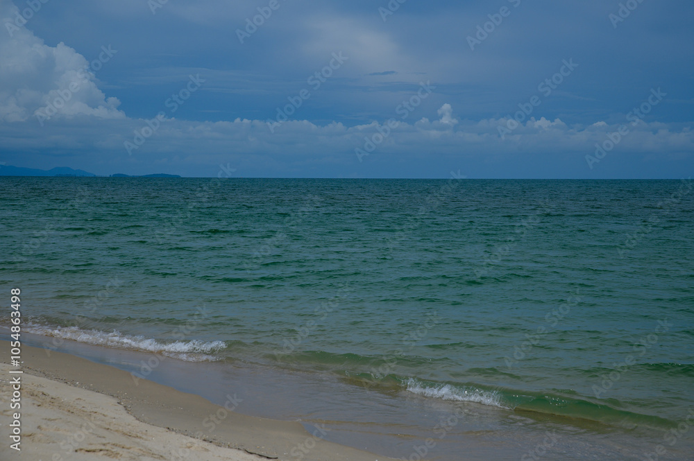 Beach sunrise with waves, tropical coast, ocean horizon, and soft morning light Beach sunrise with waves, tropical coast, ocean horizon, and soft morning light