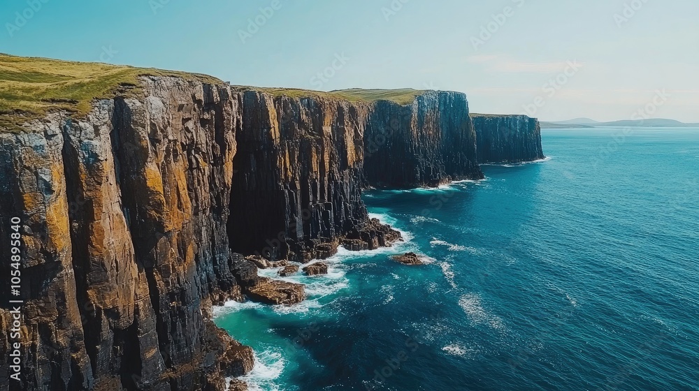 Scenic view of the coastline near Fingal's Cave, showcasing the rugged cliffs and turquoise waters typical of the Scottish Hebrides. No people included. Scenic view of the coastline near Fingal's Cave, showcasing the rugged cliffs and turquoise waters typical of the Scottish Hebrides. No people included.