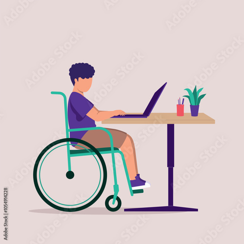Side View Of One Disabled Little Boy In Wheelchair Using A Laptop At The Desk.