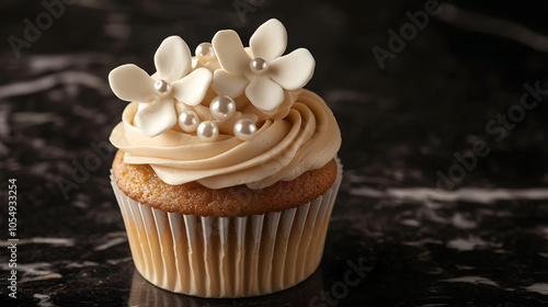 Wallpaper Mural An elegant cupcake topped with white flowers and pearls sits on a dark surface. Torontodigital.ca