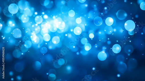 Vibrant blue bokeh background creating a dreamy atmosphere with soft light effects at night