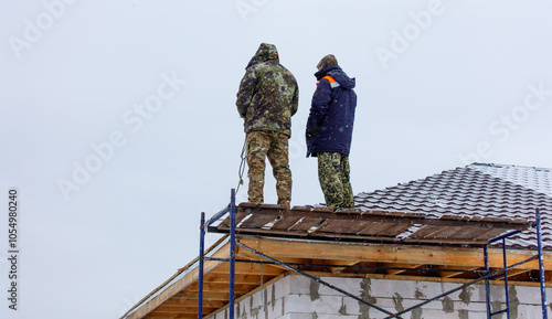 Wallpaper Mural Two men are standing on a roof in the snow Torontodigital.ca