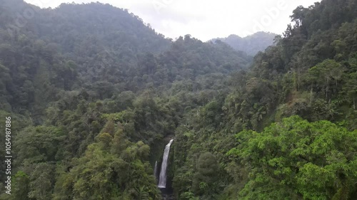 Aerial view drone footage of hidden beach of Indonesia, Gomblang waterfall in the middle of forest 