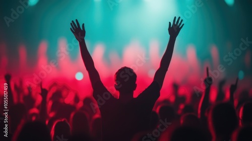 Energetic crowd of people cheering and dancing passionately at a lively music festival or concert with a DJ performer spinning records and mixing music on a brightly lit stage in the background