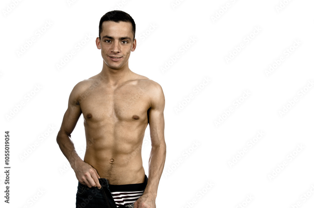 Young attractive man with athletic body posing in studio. Young attractive man with athletic body posing in studio.