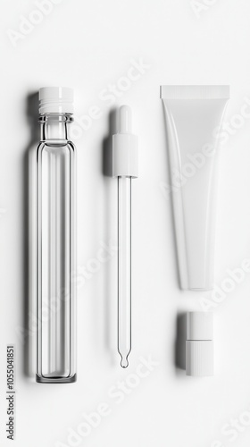 Elegant mockup features a glass serum bottle, dropper, and cream tube for skincare products photo