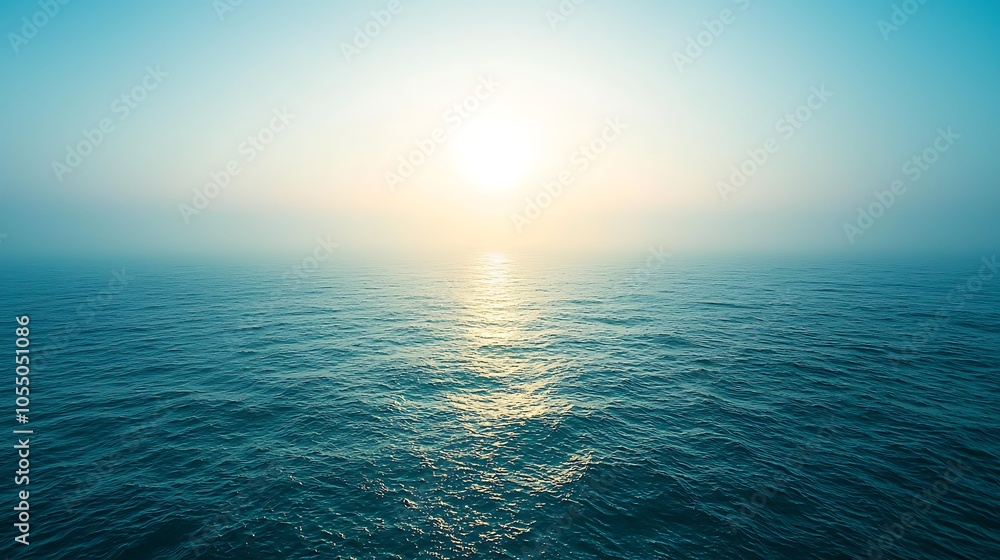 Ocean Waves Under a Hazy Blue Sky, Calm Water with the Sun Shining Through Ocean Waves Under a Hazy Blue Sky, Calm Water with the Sun Shining Through