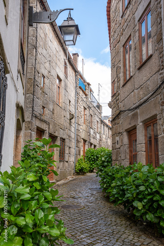 Picturesque medieval narrow alleyway in the center of Tracoso, showing the alley Rua de Alegria photo