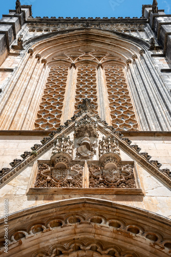 Southern portal to the medieval church of Santa Maria da Vitoria monastery in Batalha, a manueline gothic masterpiece photo