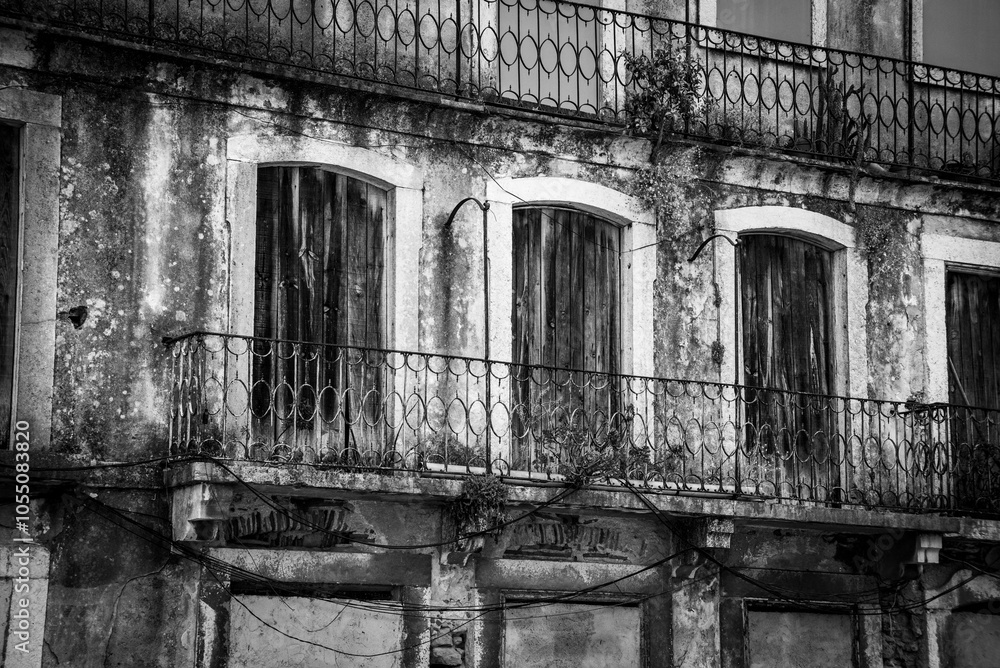 An old ruined house in historic district of Castelo in Lisbon near castle of Saint Jorge An old ruined house in historic district of Castelo in Lisbon near castle of Saint Jorge