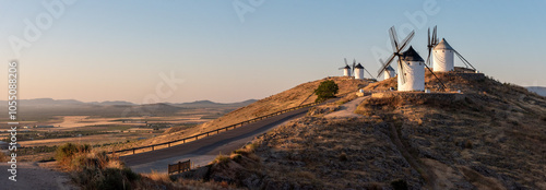 Iconic historic windmills in Consuegra at sunrise, Spain, known from Cervantes novel Don Quichotte