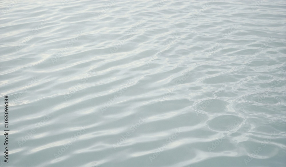 Blurred desaturated transparent clear calm water surface texture with splashes and bubbles. Trendy abstract nature background. White-grey water waves in sunlight Blurred desaturated transparent clear calm water surface texture with splashes and bubbles. Trendy abstract nature background. White-grey water waves in sunlight