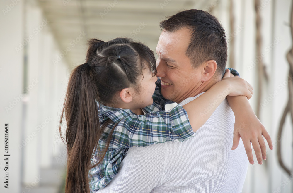 Happy smiling Asian father and daughter staying together, concept image for healthy family, good father, middle aged dad parenting, child development Happy smiling Asian father and daughter staying together, concept image for healthy family, good father, middle aged dad parenting, child development