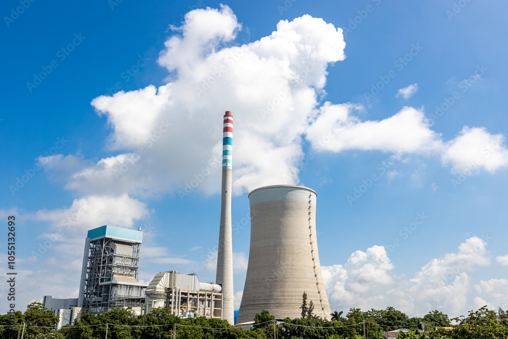A thermal power station that emits steam under the scorching sun A thermal power station that emits steam under the scorching sun